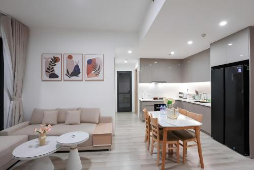a living room with a couch and a table at Ataraxia Residences in Gò Công