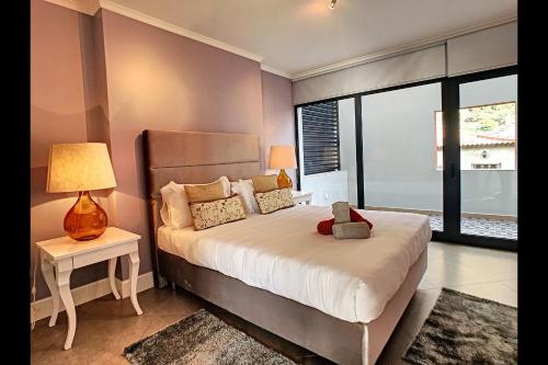 a bedroom with a bed and a large window at Villa do Paul by LovelyStay in Paul do Mar