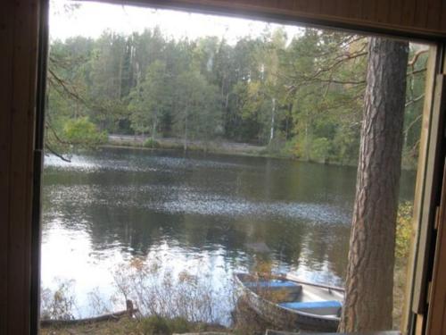 a view of a lake from a window at Tivedens Hostel-Vandrarhem in Karlsborg