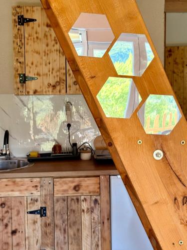 a kitchen with a wooden counter with a window at Montenegro pines in Bistrica Lipovska