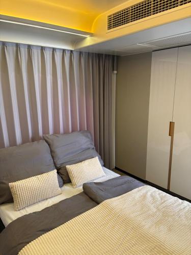 a bed with two pillows on it in a room at Capsule house for rent at Gut Holtmann in Billerbeck