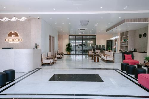 a lobby of a hotel with a hair salon at Horizon Minh Chau Hotel in Quang Ninh