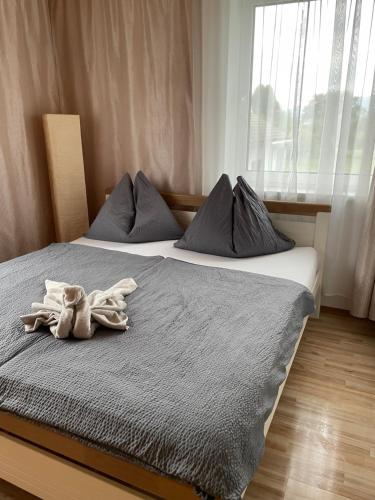 a bedroom with two beds with towels on them at Haus Lisa in Kroisbach