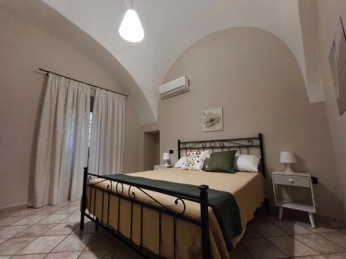 a bedroom with a bed in a room at Nalusa Home in Sarno