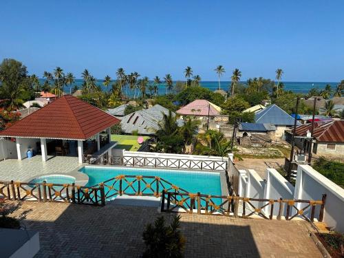 an aerial view of a house with a swimming pool at Alfa Boutique Hotel in Kiwengwa
