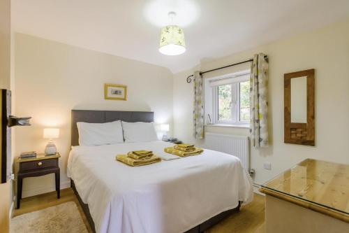 a bedroom with a white bed and a window at 1 Bed in Snape oc-9tts in Snape