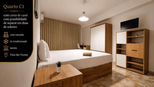 a hotel room with a bed and a tv at Rooms4you 3 in historic center of Braga in Braga