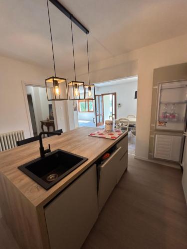 a kitchen with a sink and a counter top at Casa vacanza Giardinolago in Sale Marasino