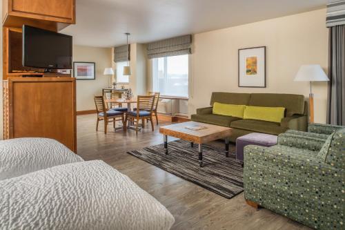 a living room with a couch and a table at Staypineapple, Watertown Hotel, University District Seattle in Seattle
