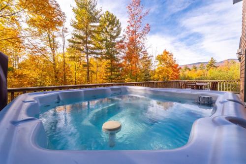 a hot tub on the back of a house at Beautiful Home, Views, Near Whiteface, Lake Placid in Wilmington