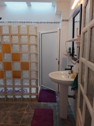 a bathroom with a shower and a sink at Rent Vacancy Arcoiris in Tías