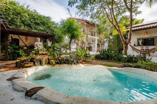 a swimming pool in the backyard of a house at Preá Kite House in Prea