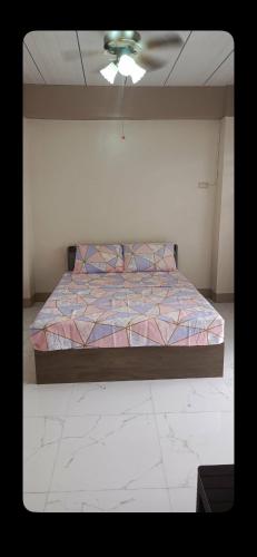 a bedroom with a bed in a room at Melinda Place in Camarin