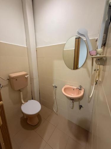 a bathroom with a toilet and a sink at Hotel Empire Banting in Banting