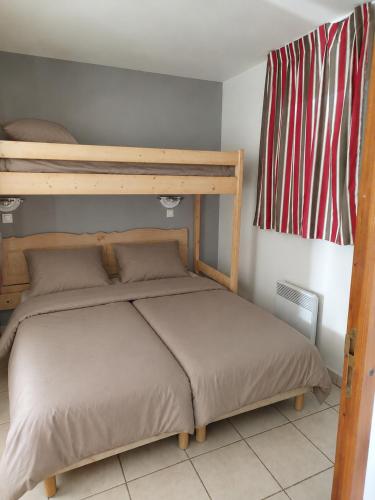 a bedroom with a bunk bed in a room at Soleiou in Salavas