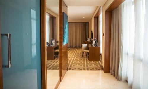 a corridor of a hotel room with a hallway at Rosh Olaya in Riyadh