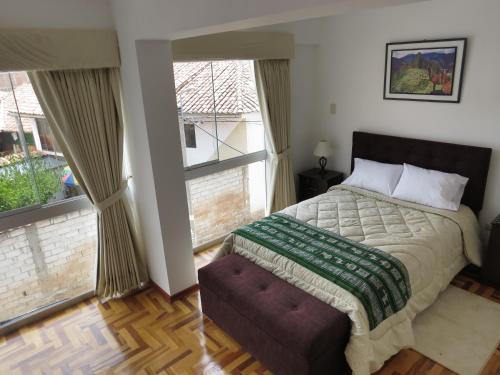 Кровать или кровати в номере Apartamentos Quewe