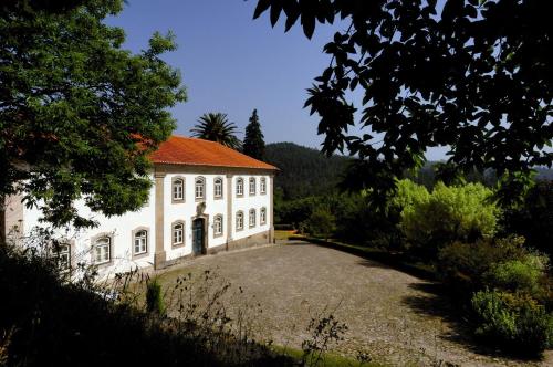 a large white building with a red roof at Casa do Condado de Beirós in São Pedro do Sul