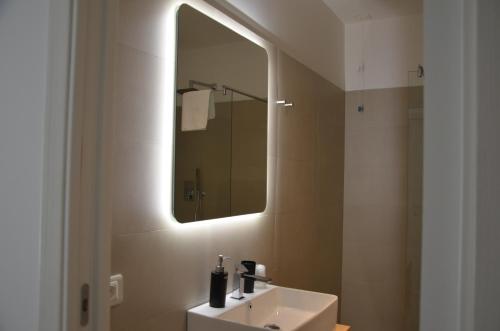 a bathroom with a sink and a mirror at Hotel Venere in Ascea