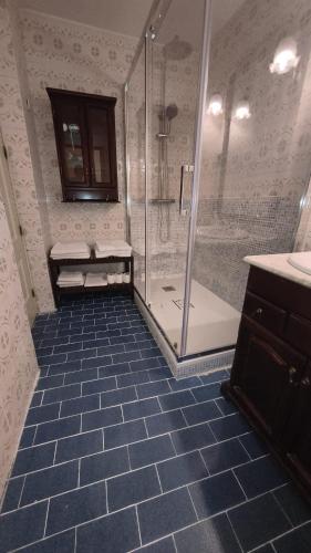 a bathroom with a shower and a sink at Atocha Palace in Madrid