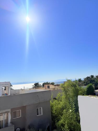 a view of the beach from the roof of a building at Bedro Rooftop Studio 2 Private Balcony Sea View 30 Sec to Sea in Dahab