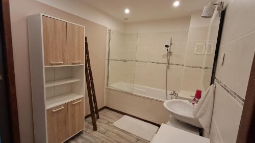 a bathroom with a sink and a toilet and a shower at La Maillitardaise - Table d'Hôte in Saint-Pierre-de-Fursac