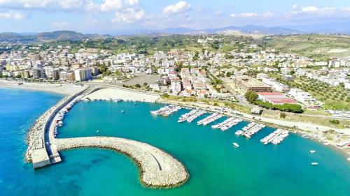 an aerial view of a harbor with boats in the water at Il Pero Selvatico in Borgia