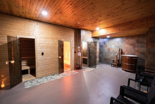 a large room with wooden walls and a wooden ceiling at Hotel Jantar Dudince in Dudince