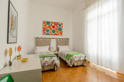 Postel nebo postele na pokoji v ubytování Casa Michelangelo