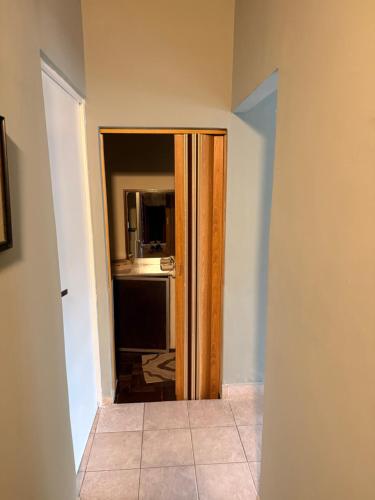 an open door to a kitchen with a refrigerator at Marea in San Lorenzo