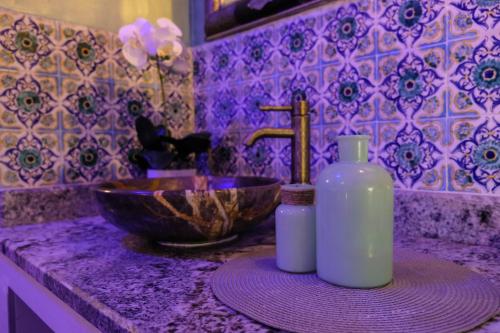 a bathroom counter with a sink and a bowl at EVASION by LIBERTE in Oran