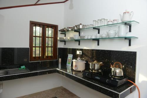 Η κουζίνα ή μικρή κουζίνα στο Keshan Villa