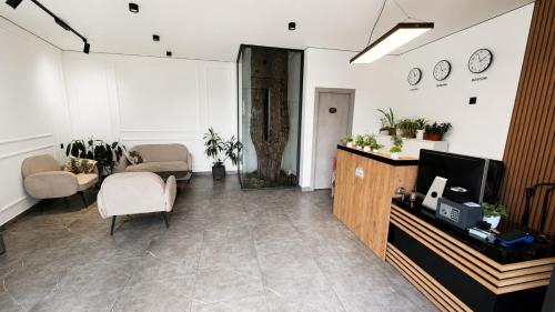 a living room with a tv and a couch and a table at Sochi Resort-Pine Garden Boutique Hotel and Pool Stepanavan in Stepʼanavan