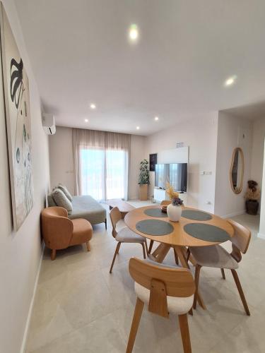 a living room with a table and chairs at 4 stars - apartments Senj in Senj