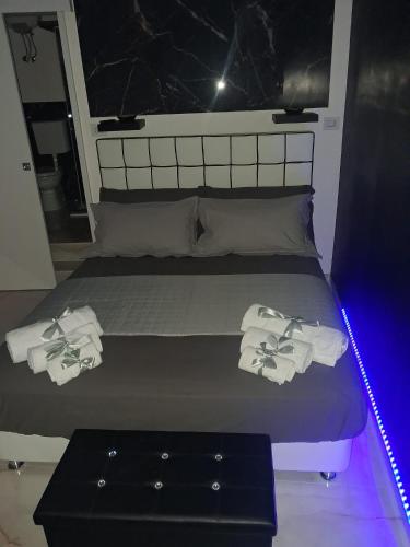 a bedroom with a bed with towels on it at Sogno nella Corte in Bitonto