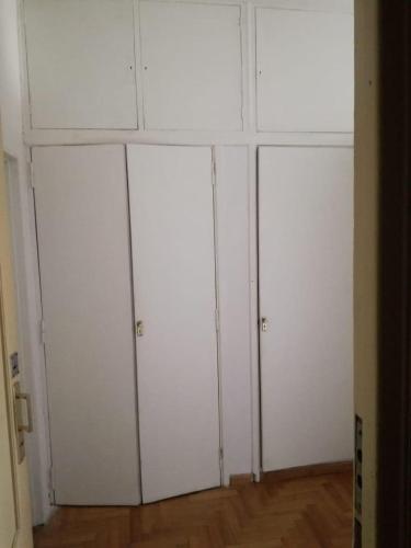 a group of four white cabinets in a room at Centro Obelisco in Buenos Aires