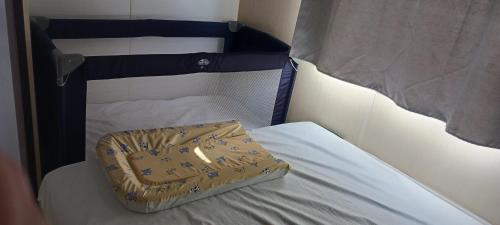 a bag sitting on top of a bed at El sol in Port-la-Nouvelle