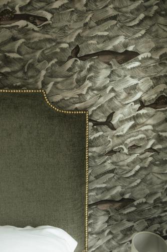 a bedroom with a bed with a gold chain at The Seafield Arms Hotel Cullen - Self Catering in Cullen