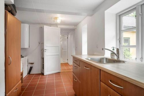 a kitchen with a sink and a counter top at 3309-Stege-Holmemosevej-9 in Stege