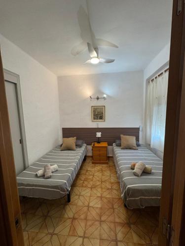 a room with three beds and a ceiling at Faro28 in Valencia