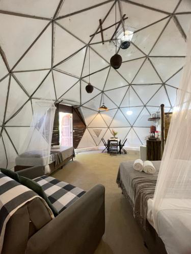 a large room with two beds and a table at Mirante Morere in Moreré