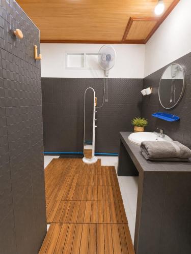 a bathroom with a sink and a toilet and a mirror at SU house Koh Phangan in Thong Nai Pan Yai