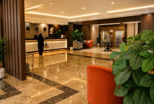 a man standing in the lobby of a hotel at فندق امان أبها - المحالة in Abha