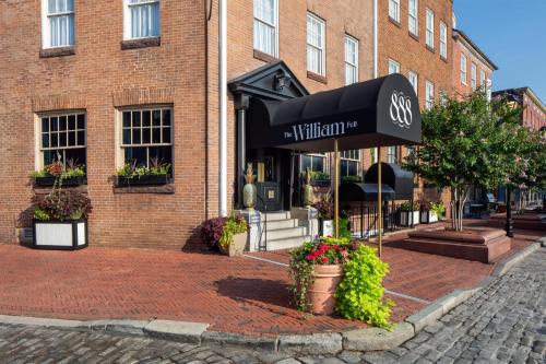 a building with an awning in front of a building at The William Fell Baltimore, Tapestry Collection by Hilton in Baltimore