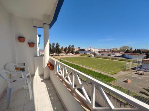 a balcony with a view of a tennis court at Mivô - Alcochete Views & Comfort in Alcochete