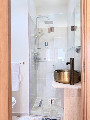 a bathroom with a sink and a shower at Riad Marrakech, oasis apartment in Marrakesh