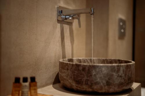 a sink with a water faucet on a counter at Manas Villas in Elaiokhórion
