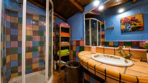 a bathroom with a sink and a shower at Casa Nazari in Benaocaz