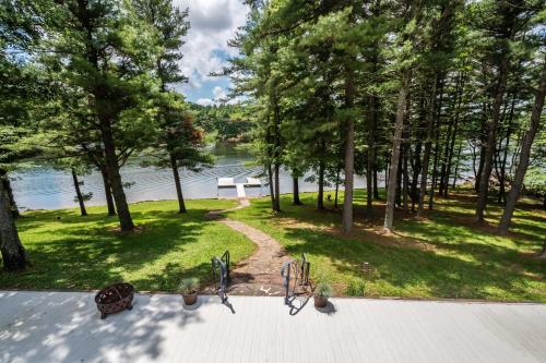 an aerial view of a park with trees and a lake at Swans Nest in Swanton