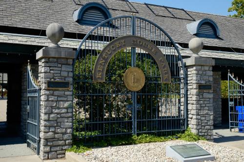 a gate with a sign in front of a building at Baymont by Wyndham Georgetown Lexington North in Georgetown